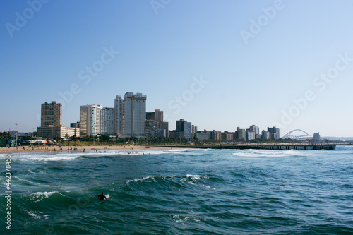 Ocean, coast and city skyline of Durban, South Africa.