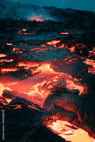 Atmospheric close-up view of flowing lava at volcano eruption site in Geldingadalir, Iceland — June 2021