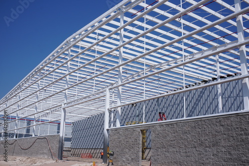 Metal wite frame of the new building against the sky