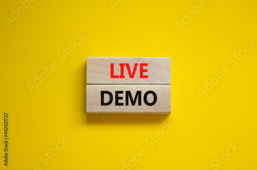 Live demo symbol. Concept words 'live demo' on wooden blocks on a beautiful yellow background. Copy space. Business and live demo concept.