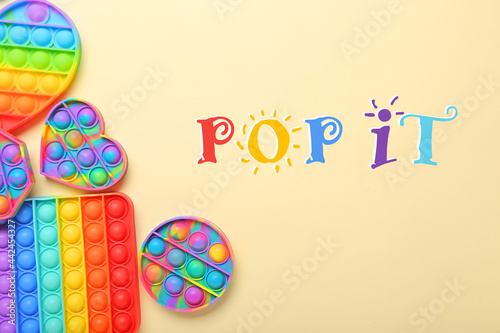 Bright fidget toys on color background