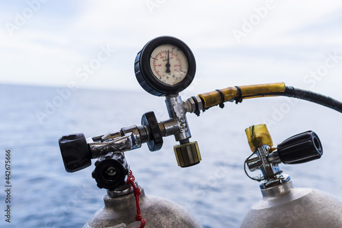 Scuba Diving Tanks Compressor on a Gas Tank Diving Equipment on a dive boat in the gulf of Thailand with copy space no people