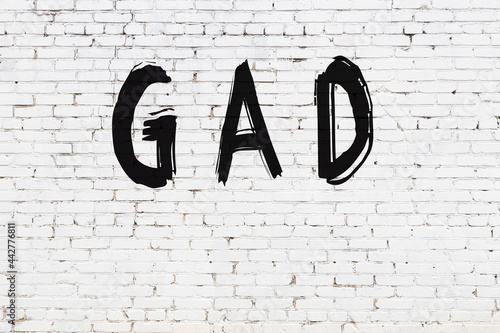 Inscription gad painted on white brick wall