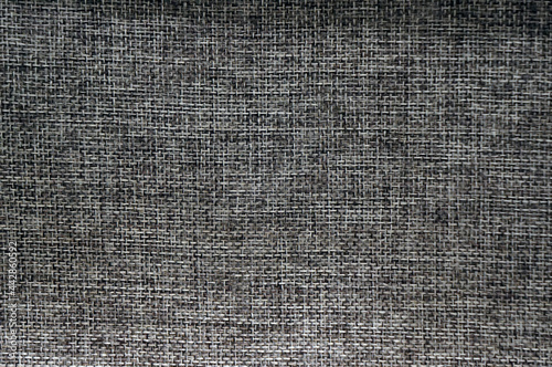 Fabric texture synthetical for background. Gray polyester fabric textile backdrop for interior art design or add text message.