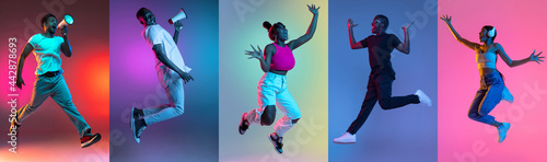 Group of people, young joyful women and men jumping isolated over multicolored neon backgrounds.