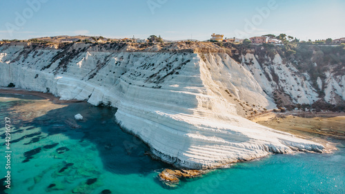 Scala dei Turchi,Sicily,Italy.Aerial view of white rocky cliffs,turquoise clear water.Sicilian seaside tourism,popular tourist attraction.Limestone rock formation on coast.Travel holiday scenery