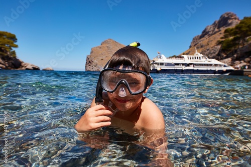 Little boy enjoying snorkeling on summer holiday.