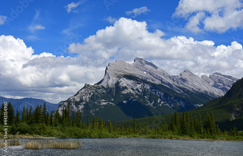 dramatic mount rundle on a sunny day, as seen across the vermilion lakes in banff national park, alberta, canada, in the rocky mountains