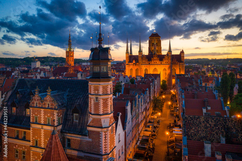 Amazing architecture of the main city in Gdansk at sunset, Poland. Aerial view of the Long Market, Main Town Hall and St. Mary Basilica