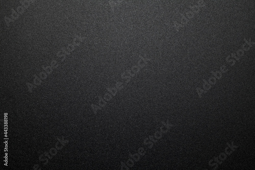 Black plastic material texture background. Close-up.