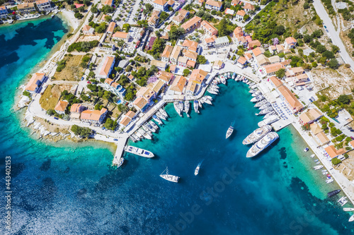 Beautiful Fiscardo village at Kefalonia or Cephalonia Island. Yachting bay and a ferry ship in the port