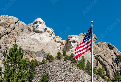 American flag waiving in front of Mount Rushmore