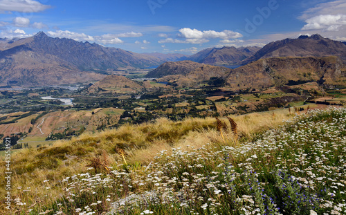 spectacular view across speargrass flat lower shotover, and dalefield to lake hayes, from coronet peak. near queenstown on the south island of new zealand