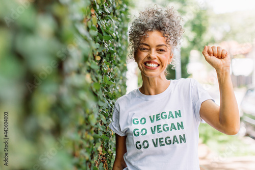 Smiling vegan activist advocating for veganism