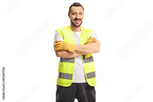 Smiling man waste collector in a uniform and gloves