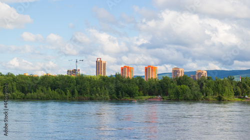 Summer landscape of Krasnoyarsk city. Modern apartment buildings by the Yenisey river