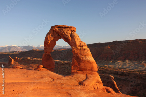 delicate arch and the la sal mountains in late afternoon, in arches national park, near moab, utah