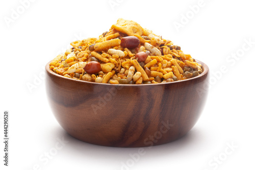Close up of spicy Ratlami mixture Indian namkeen (snacks) In hand-made (handcrafted) wooden bowl.