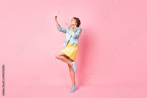 Full size profile photo of optimistic nice brunette lady blow kiss wear jacket dress isolated on pink color background