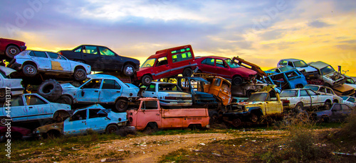  Pile of discarded cars on junkyard