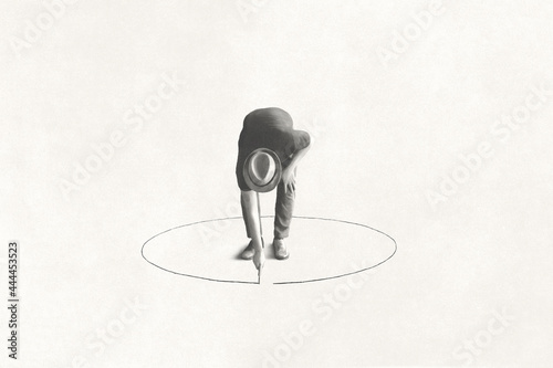 man drawing black circle around him with chalk, loneliness concept