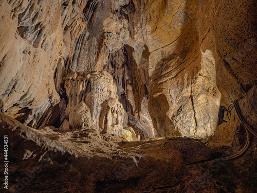 Rocks of one of the routes of the caves of San José; caves with huge lakes located in Spain. Geological expedition. The longest underground river in Europe dating back to the Triassic.