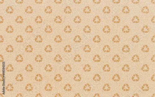 Recycle symbol pattern on brown paper background