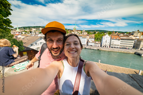 happy tourist couple friends taking a selfie photo in Zurich, Switzerland