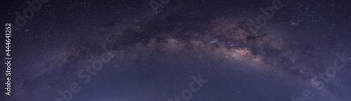 Panorama purple and blue night sky milky way and star on dark background.with noise and grain.Photo by long exposure and select white balance.