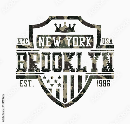 Brooklyn shield design for camouflage t-shirt. New York camo tee shirt print with shield, crown, USA flag and grunge. Typography graphics for apparel in military and army style. Vector illustration.