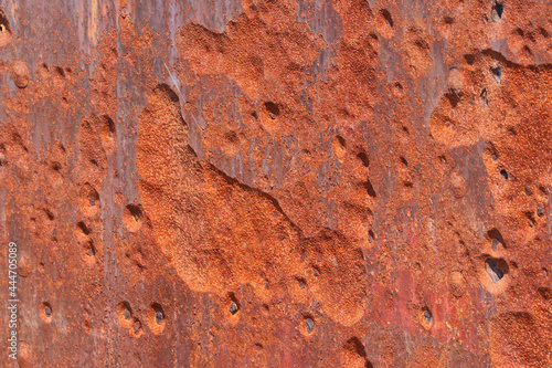Abstract backgroundof close up pitted rusty metal surface