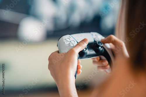Closeup Hand of woman playing a computer games with joystick