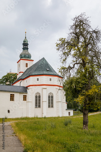 Krasne Brezno, Bohemia, Czech Republic, 26 June 2021: Saxony style renaissance church of St. Florian with white tower and gothic windows, National cultural monument in summer day