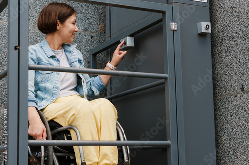 Mid aged smiling brunette disabled woman