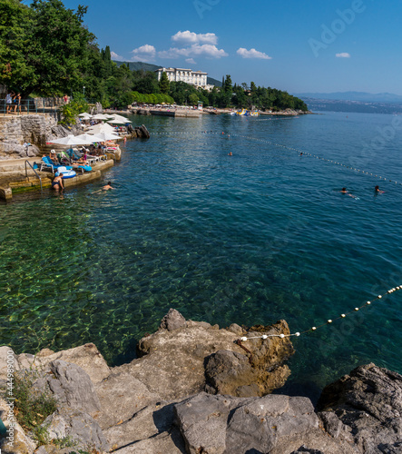 Stony coastline and transparent amazing water of the Adriatic Sea. Opatija resort, Croatia.