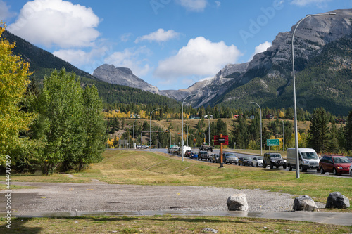 Cars on highway with rocky mountains in Canmore at Banff national park