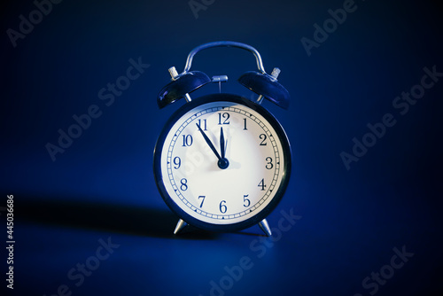 Analog clock on blue background