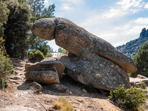 Phallus-shaped rocks composed of the characteristic rock of the landscape of La Pedriza in Madrid, on the southern slope of the Sierra de Guadarrama, a sunny day with a beautiful blue sky with clouds