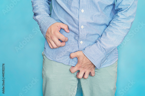 Man scratch the itch with hand, Penis, itching, Concept with Healthcare And Medicine. urinary incontinence. Itching in the groin.