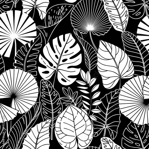 Seamless pattern with white tropical leaves on black background.