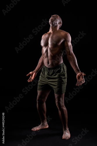 African American man with hands open and head bent backwards