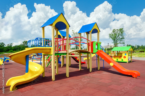 Children playground equipment. Colorful playground empty. Outdoor playground set. Play area. Play yard. Children slide park equipment. School yard. Play ground