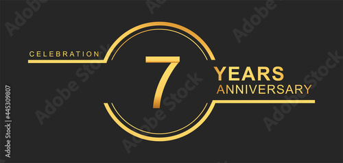 7th years anniversary golden and silver color with circle ring isolated on black background for anniversary celebration event