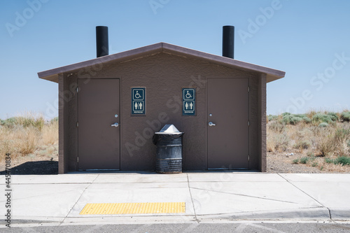 Pit toilets with two stalls at a rest area in Benton County Washington, a rural area