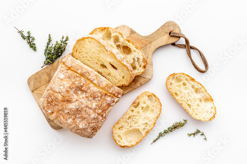 Sliced bread ciabatta with rosemary. Breakfast background