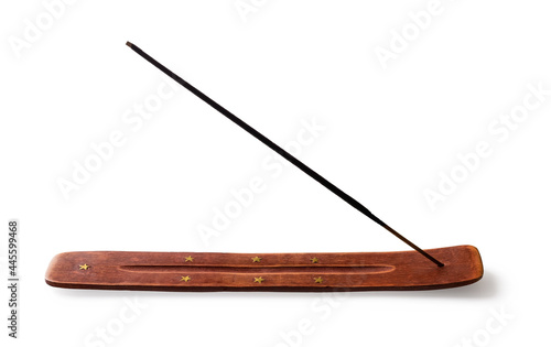 Joss stand with incense stick isolated on white background. Indian sandalwood incense stick holder decorated with seven golden stars. Wooden incense burner with stick for aromatherapy and meditation.