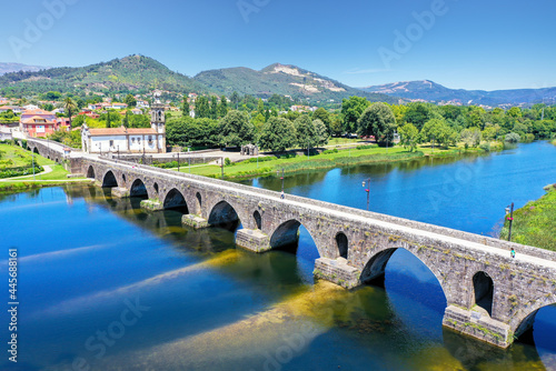 An elevated view of the beautiful medieval bridge crossing the River Lima, Portugal, which dates back to 1368.