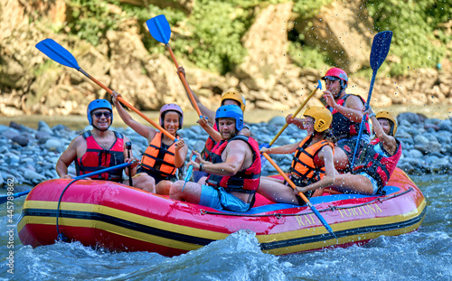 rafting on a large boat on a mountain river