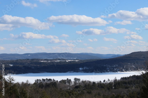 Stockbridge Bowl, also known as Lake Mahkeenac, in Massachusetts in winter with snow on the ground seen from a viewpoint known as "Olivia's Overlook"