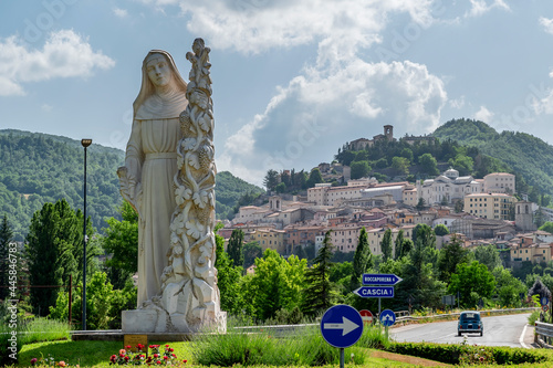 The statue of Santa Rita da Cascia welcomes the faithful at the entrance of the town, Cascia, Italy